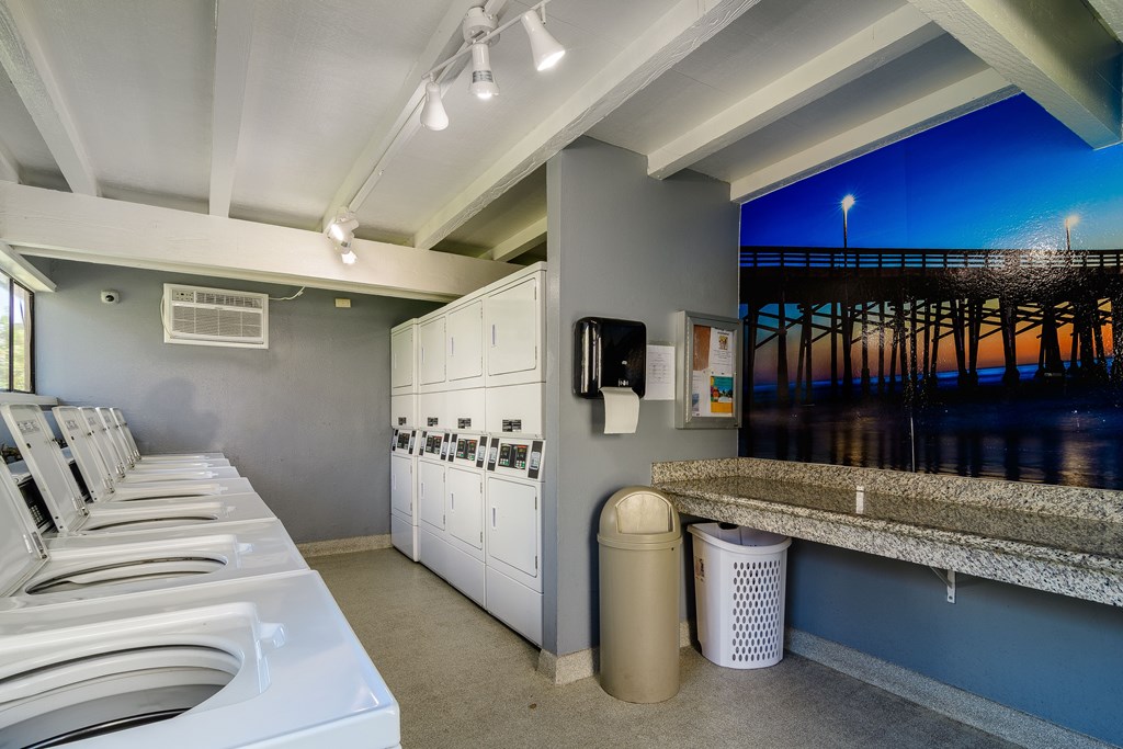 A row of washing machines in a public laundromat.