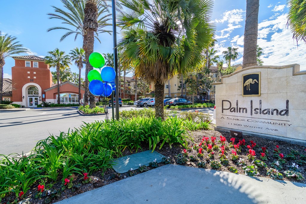 A sign for Palm Island in front of a building.