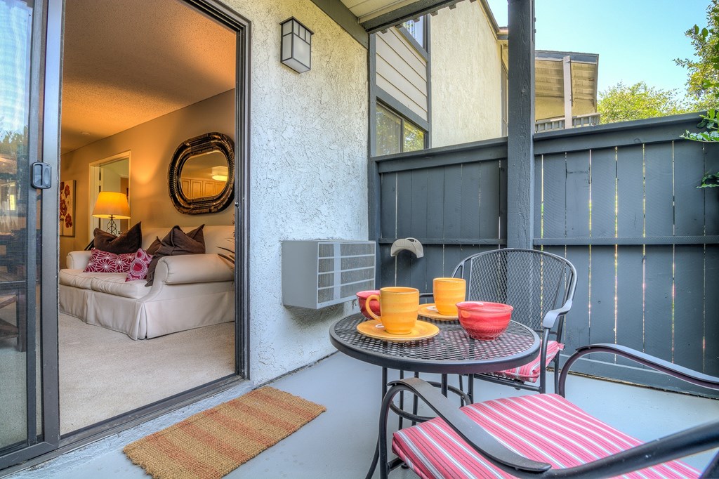 A patio with a table and chairs is shown.
