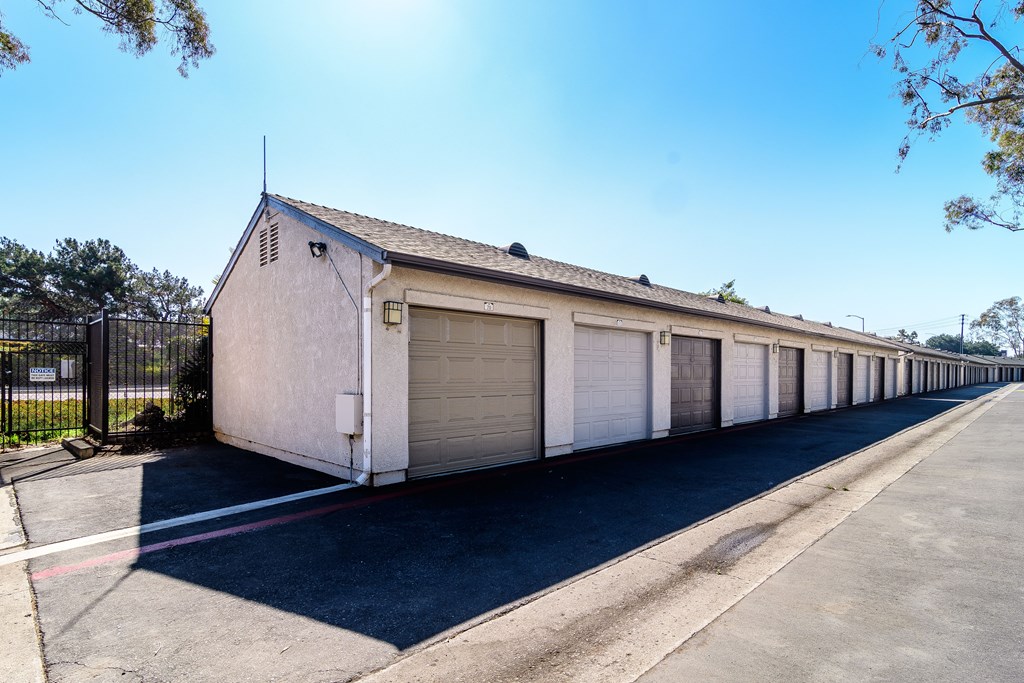 A long row of garage doors are closed.