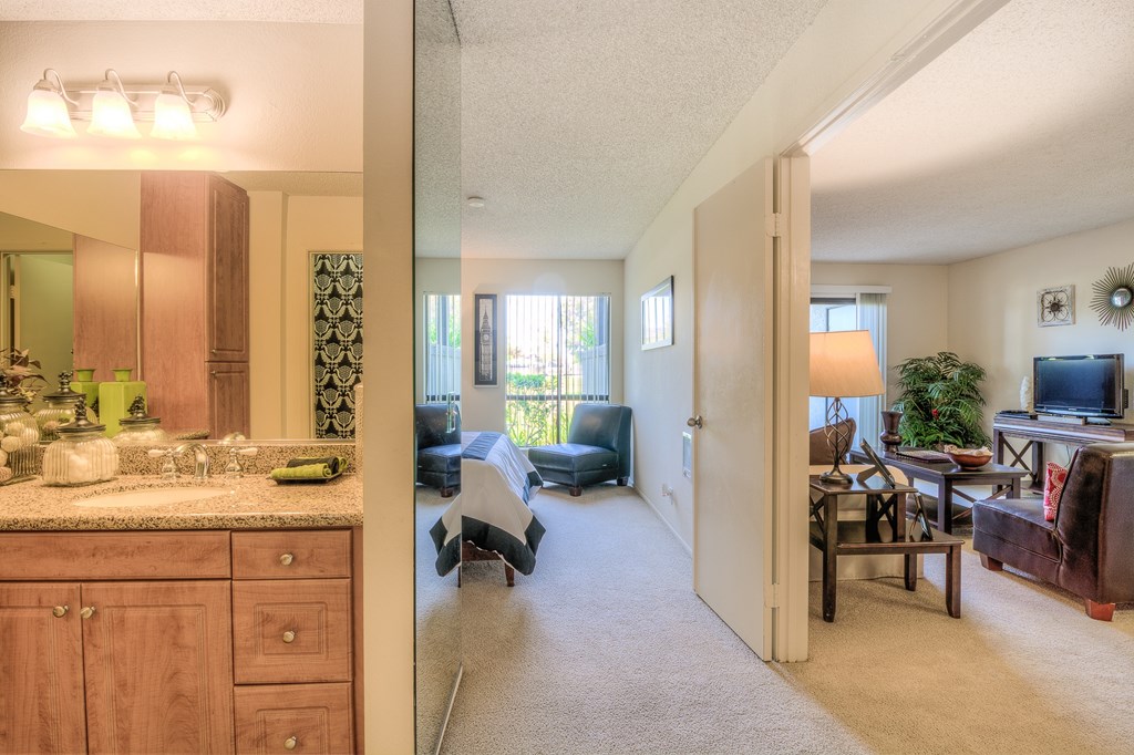 A living room with a couch and a television.
