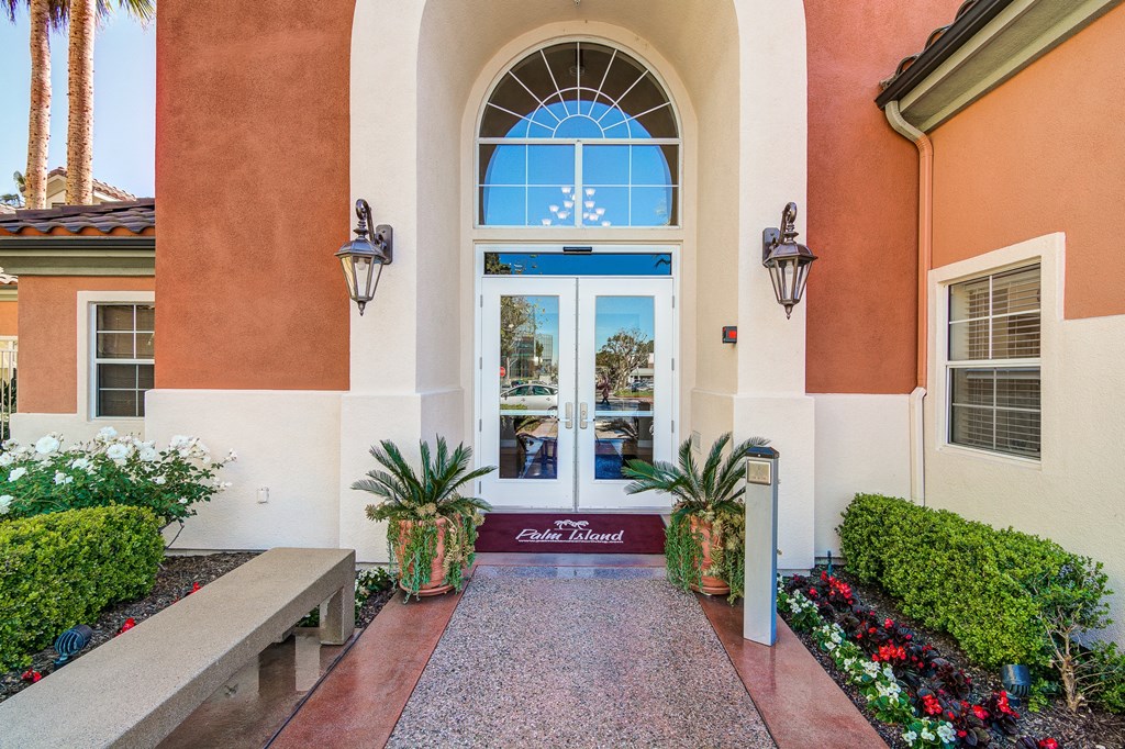 an entrance to a building with a large window and a walkway