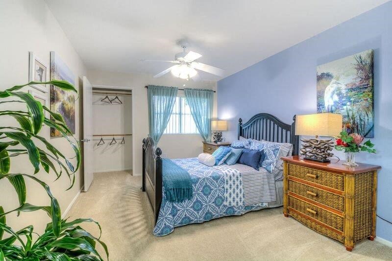 a bedroom with a bed and a dresser