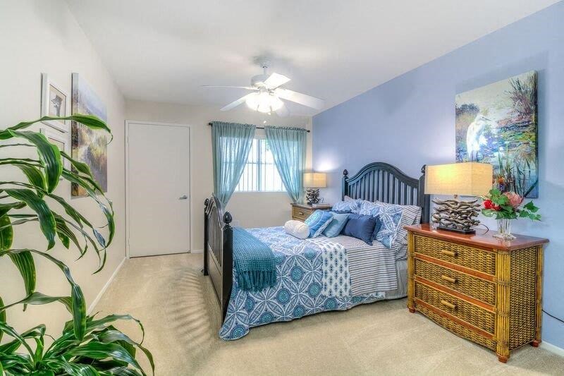 a bedroom with a bed and a dresser