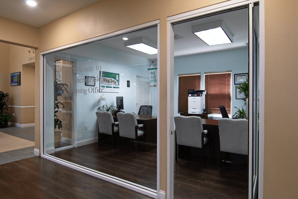 A glass door with a sign that says "Welcome to the Hiring Office" on it.