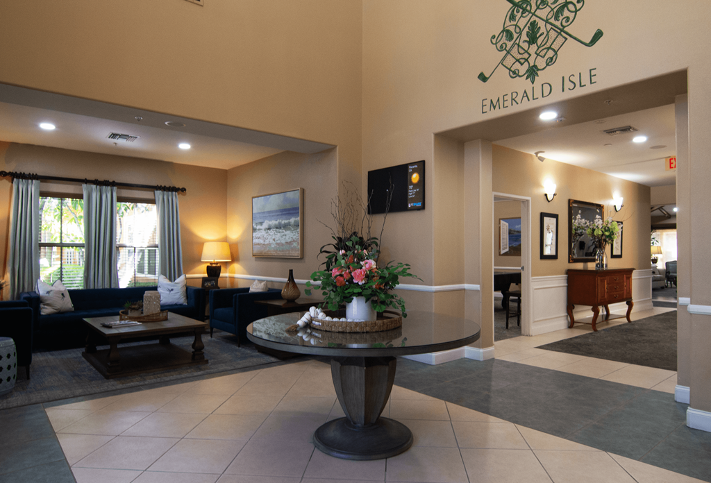 A lobby with a fountain and a sign that says Emerald Isle.