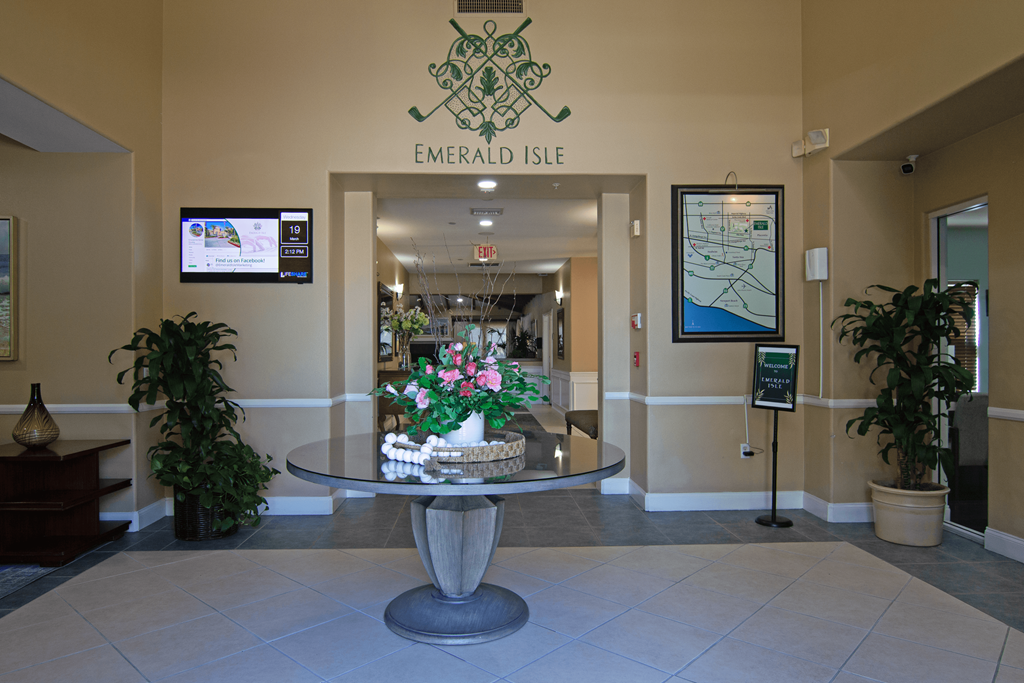 The lobby of Emerald Isle with a large table in the middle.