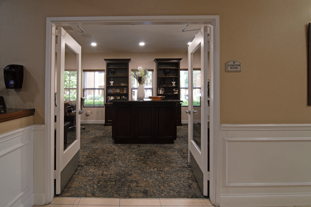 A room with a brown counter and a white door.