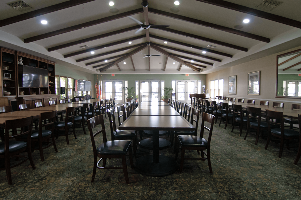 A large room with tables and chairs.