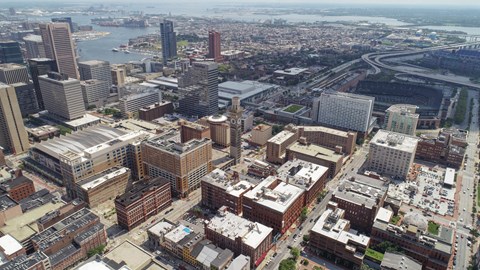 A cityscape with a mix of residential and commercial buildings.
