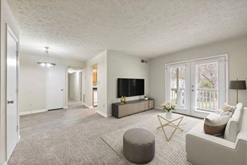 Living Room with patio access at Bradford Gwinnett Apartments