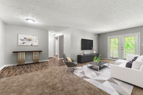 Living Room With TV at Bradford Gwinnett Apartments and Townhomes, Norcross
