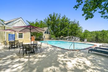 Pool With Relaxing Chairs at Bradford Gwinnett Apartments and Townhomes, Georgia