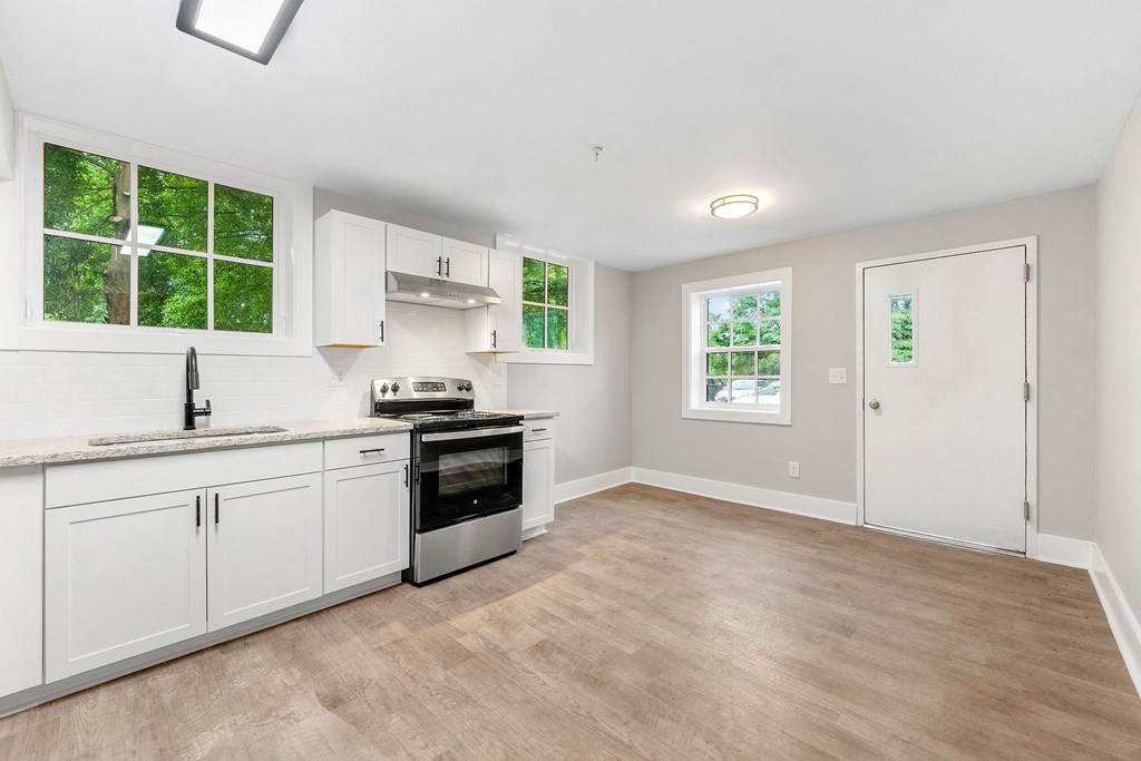Renovated kitchen and dining area at Crogman School Lofts, Atlanta, 30315