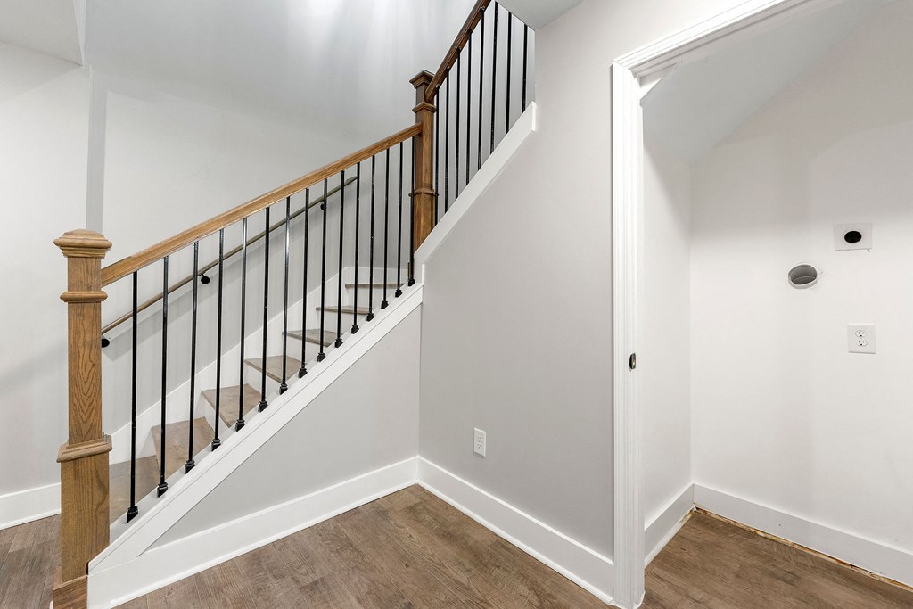 The landing of a staircase in the living room at Crogman School Lofts, Atlanta, 30315