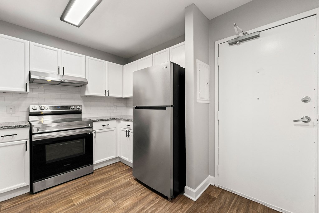 Upgraded kitchen with stainless steel appliances at Crogman School Lofts, Atlanta GA 30315