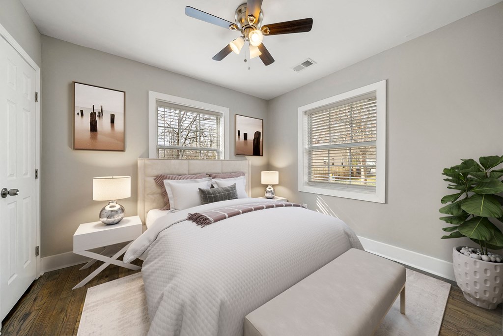 A bedroom with a bed, a ceiling fan at Balfour Marietta Apartments, Marietta