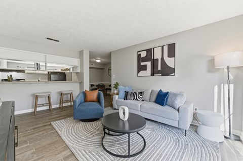 A modern living room with a white couch and a coffee table.