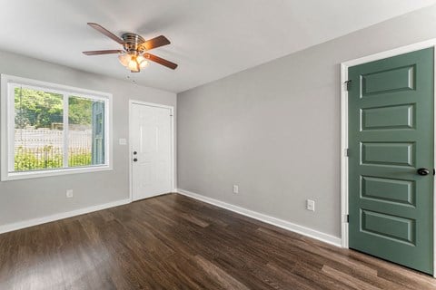 a bedroom with a ceiling fan and a window  at 1760 Memorial, Atlanta, 30317
