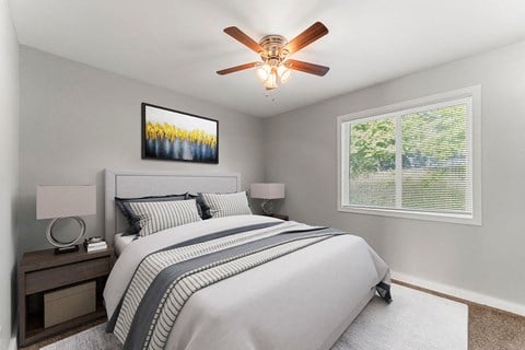 a bedroom with a bed and a ceiling fan  at 1760 Memorial, Atlanta