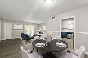 apartment living room and dining area at Pines at Lawrenceville Apartments in Decatur, 30033