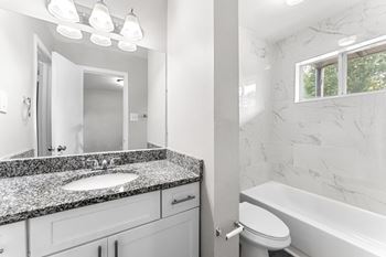 a bathroom with a sink toilet and bathtub  at Balfour 296, Lilburn, GA
