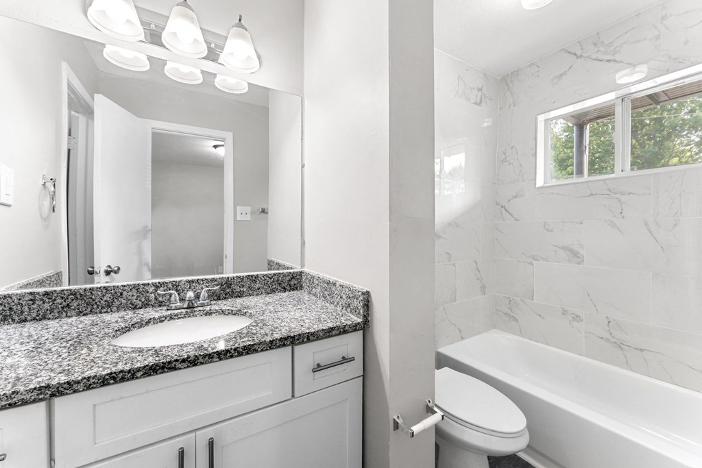 a bathroom with a sink toilet and bathtub  at Balfour 296, Lilburn, Georgia
