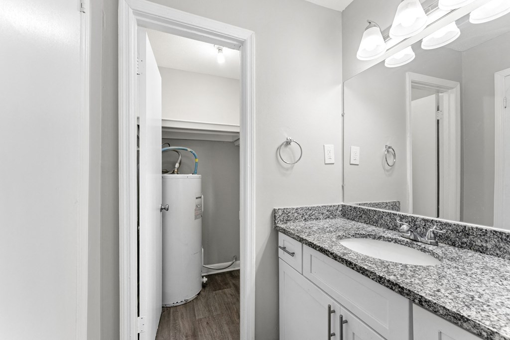 a bathroom with a sink and a mirror  at Balfour 296, Lilburn