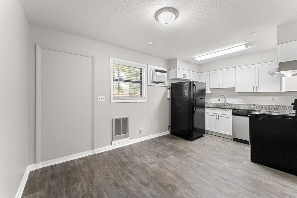 a kitchen and living room with a refrigerator and dishwasher  at Balfour 296, Georgia, 30047