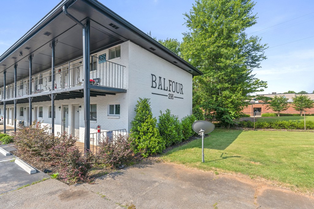 a white building with a satellite dish in front of it  at Balfour 296, Lilburn, 30047