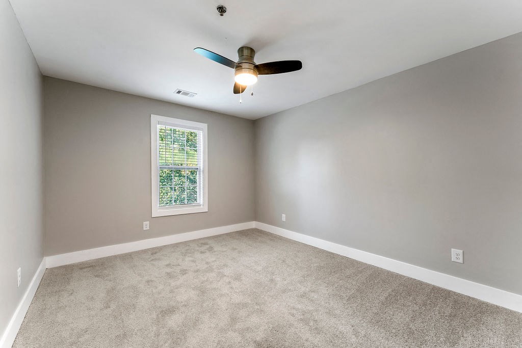 Carpeted Bedroom at Woodbriar Management, LLC, Tucker, Georgia