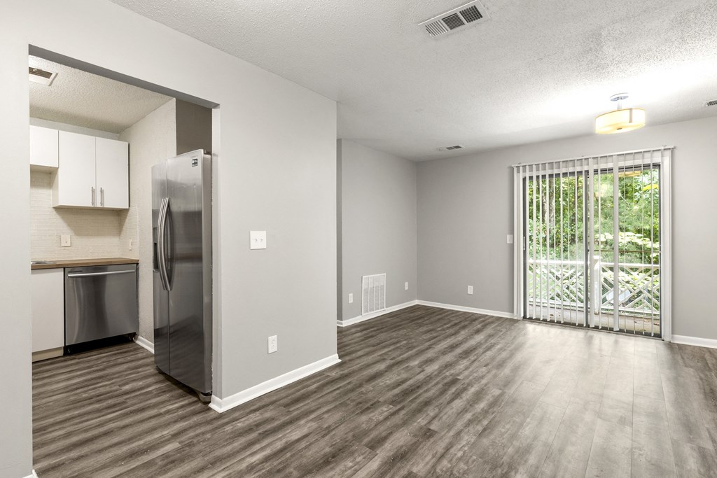 Living room and private patio at Woodbriar Management, LLC, Tucker, Georgia