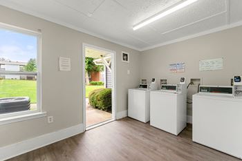 a laundry room with two washing machines and a door to a yard at 445 Cleveland, Atlanta, GA 30354