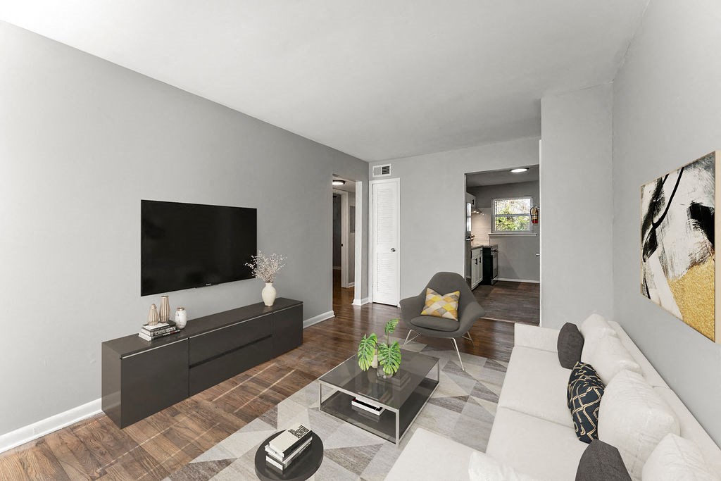 Living Room With TV at Gardens at Washington Park 1, Atlanta, Georgia