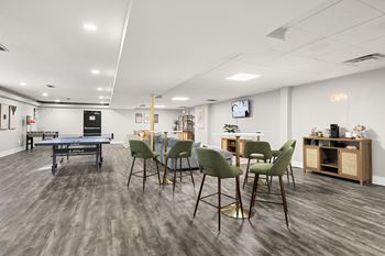 Clubroom with games and lots of lounge seating at Gardens at Washington Park, Atlanta, 30314