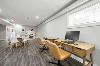 a room with desks and chairs and a computer at Gardens at Washington Park, Atlanta, GA, 30314