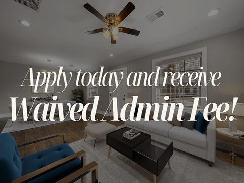 A living room with a ceiling fan and a couch with a sign that says "Apply today and receive Waived Admin Fee!".