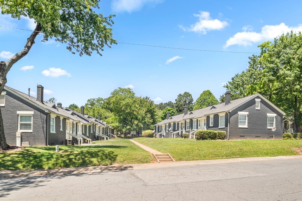A row of houses with green trees at Balfour Marietta Apartments, Marietta, Georgia