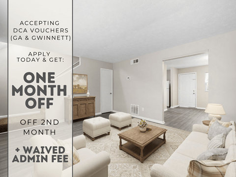 A room with a couch, ottoman, and coffee table is on sale for one month off.