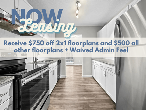 A kitchen with a sign offering a discount on floor plans.