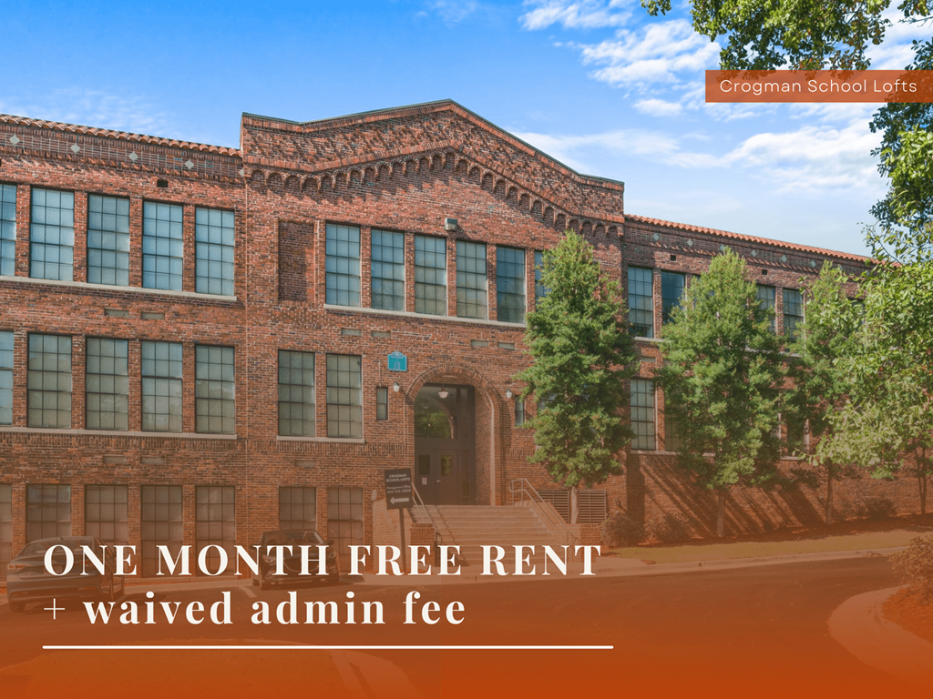 A building with the text "One month free rent + waived admin fee" in front of it.