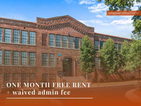 A building with the text "One month free rent + waived admin fee" in front of it.