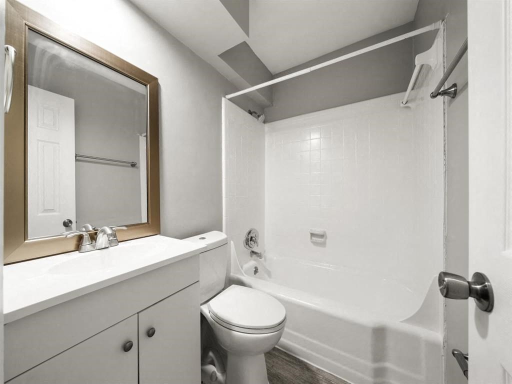 a bathroom with a sink toilet and a tub