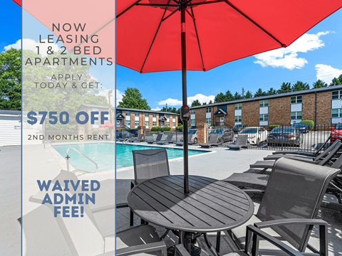 A red umbrella is in the foreground of a poolside image advertising a $750 off second month's rent for a 1 & 2 bed apartment.