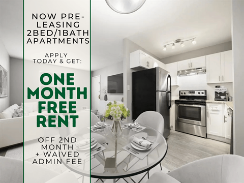 A modern kitchen and dining area with a sign offering a free rent for the first month.