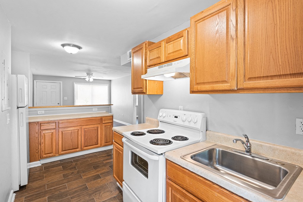 Kitchen with wooden closet at Gardens at Washington Park, Georgia