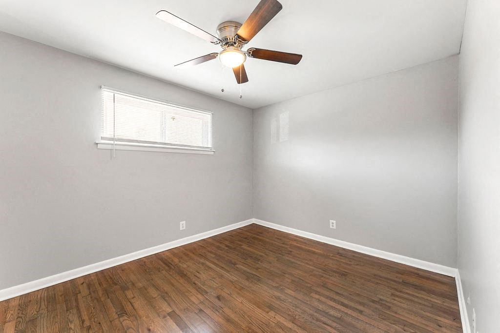 Wood-style Flooring with ceiling fan Wood-style Flooring with ceiling fan at Gardens at Washington Park, Atlanta, 30314
