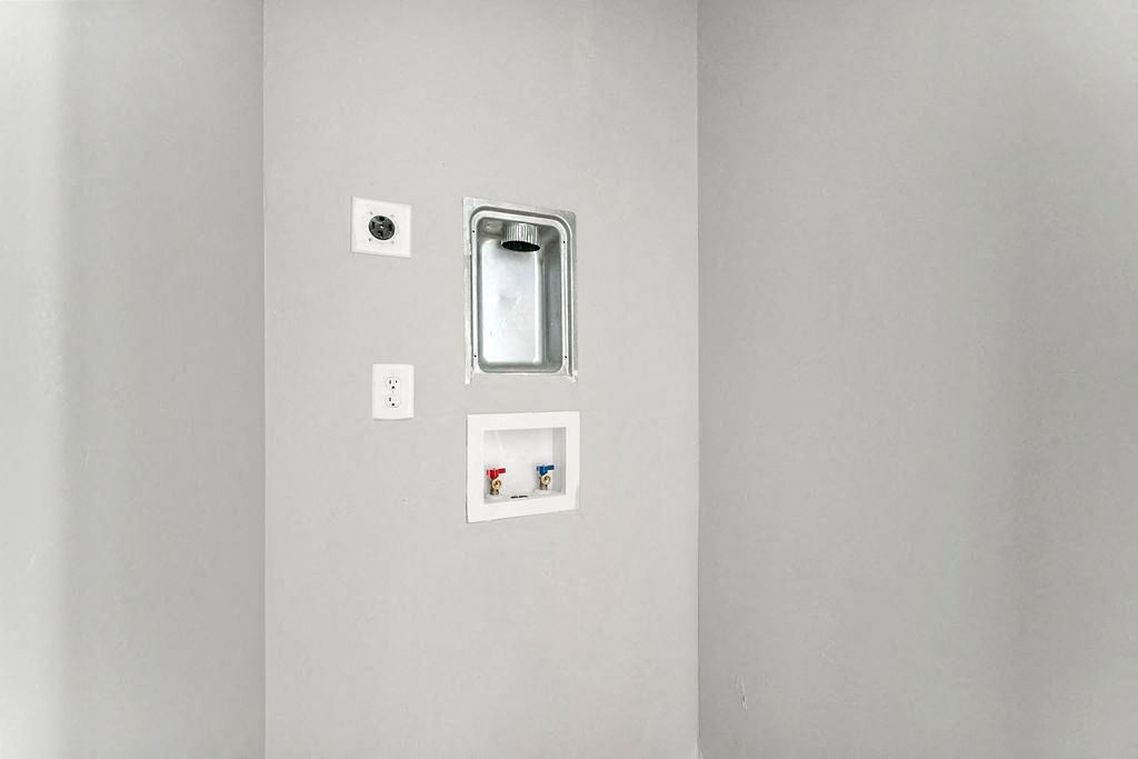 Light switch and a mirror Light switch and a mirror at Gardens at Washington Park, Georgia , 30314