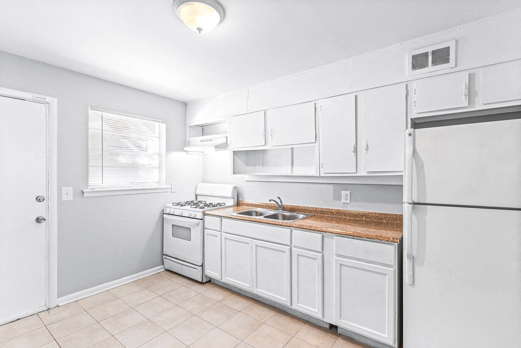 Fully Equipped Kitchen Includes Frost-Free Refrigerator, Electric Range, & Dishwasher Fully Equipped Kitchen Includes Frost-Free Refrigerator, Electric Range, & Dishwasher at Gardens at Washington Park, Atlanta, Georgia