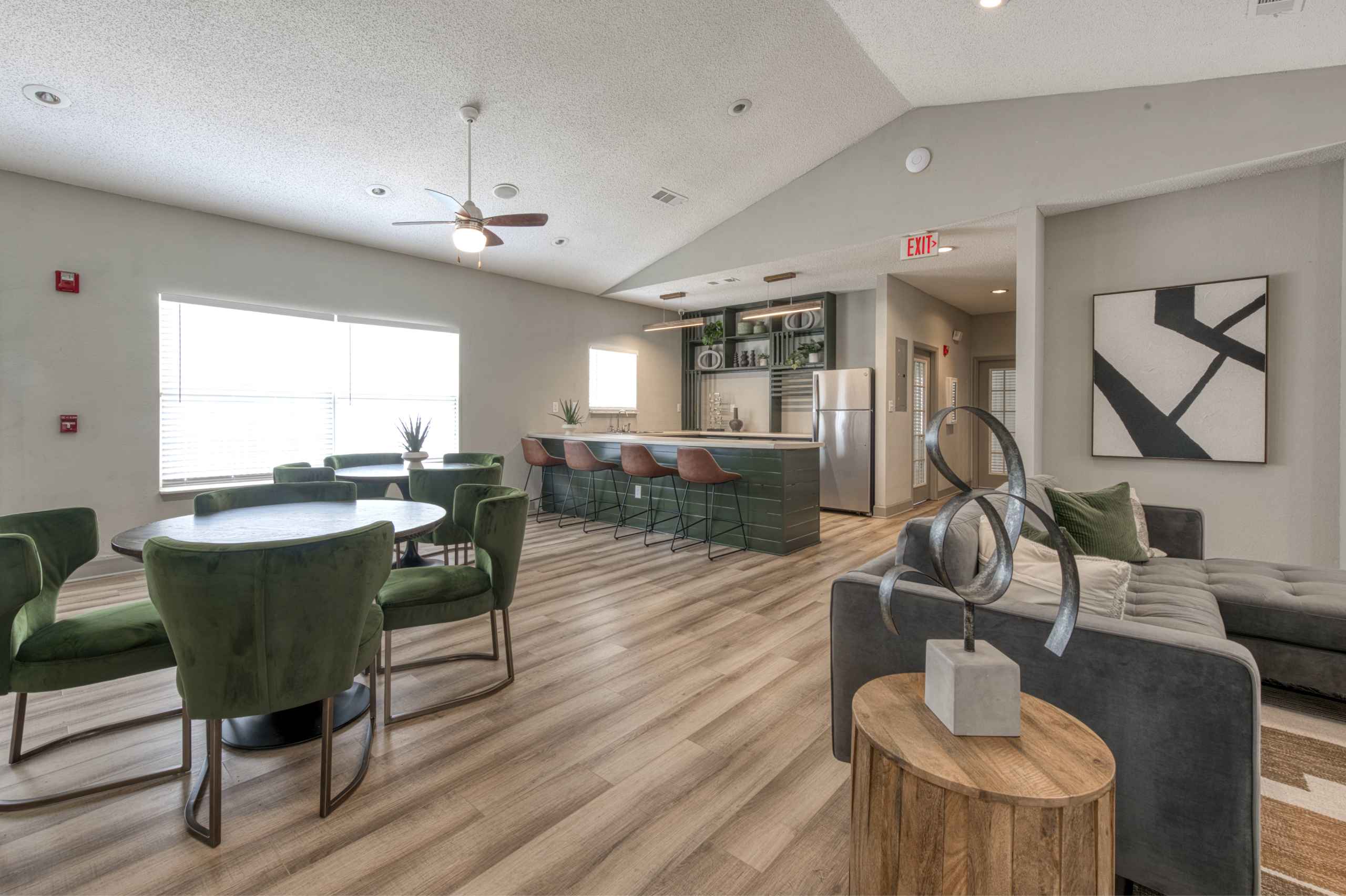 A modern living room with a dining table and chairs.